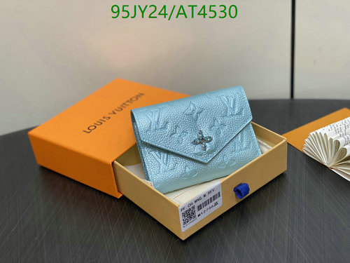 Louis Vuitton Genuine Leather Wallet with Monogram Embossing - Compact & Stylish