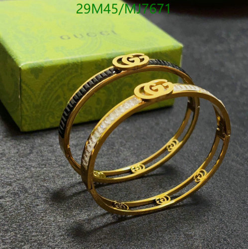 Gucci Women's Gold-Tone Bangle Bracelet with Crystal and Black Detail