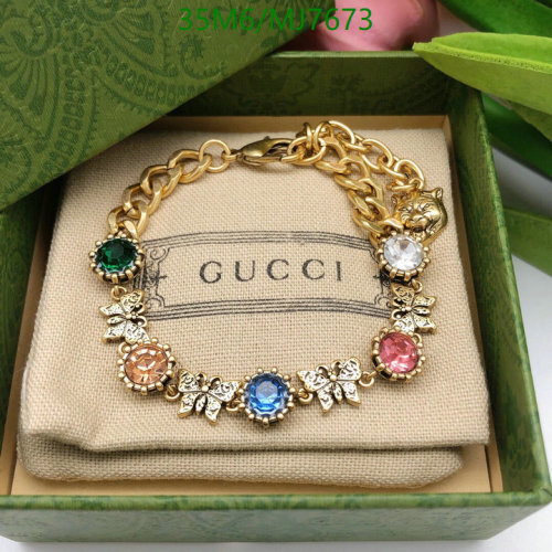 Gucci Gold-Tone Charm Bracelet with Multicolor Crystals and Lion Head Detail