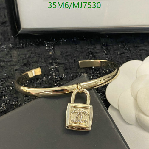 Elegant Gold-Tone Bangle Bracelet with CC Lock Charm - Stylish Women's Jewelry