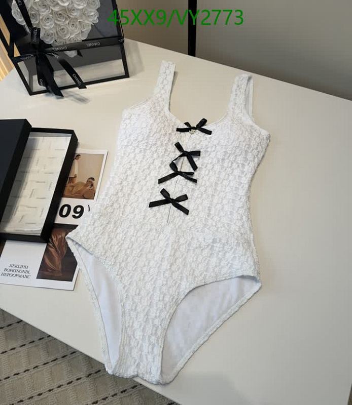 Elegant Chanel White Textured Swimsuit with Black Bow Accents