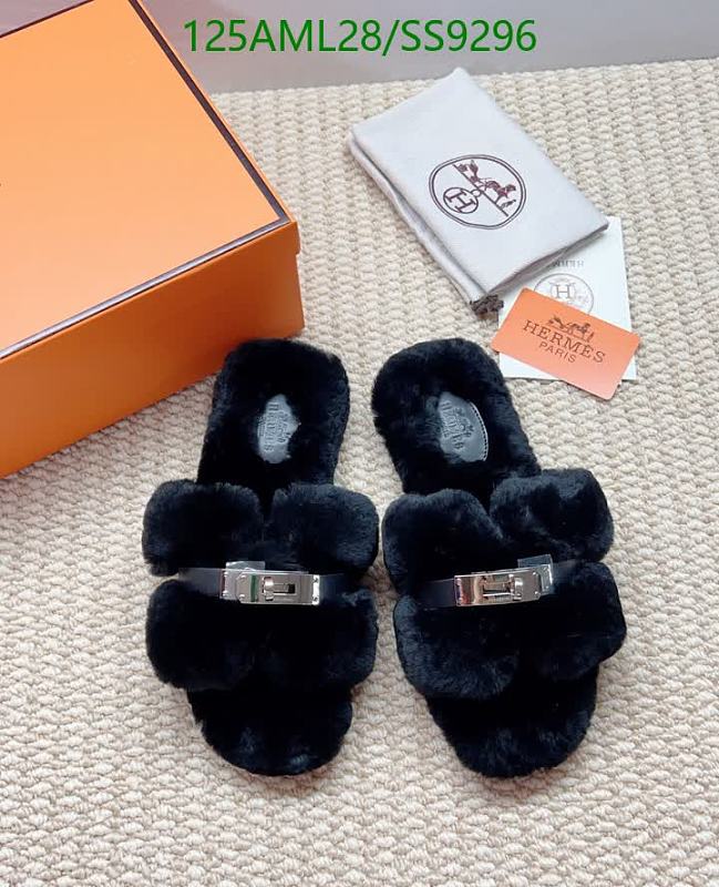Hermès Women's Black Sheepskin Furry Slides with Buckle Detail